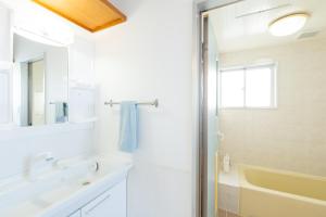 a white bathroom with a sink and a shower at AQUAMARINE HOTEL Nagahama in Nagahama +35 photos