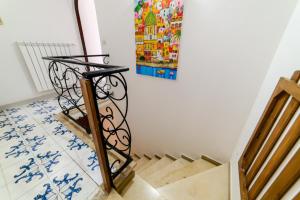 a stairway with a painting on the wall at Estate4home - Casa Bouganville in Positano