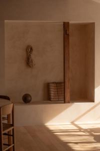a kitchen with a counter with a shelf and a table at 蜜圡 Mitzdo in Tamano