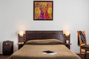 Postel nebo postele na pokoji v ubytování Aparthotel Adagio Access Paris Porte De Charenton