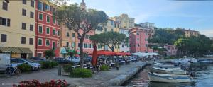 a group of boats parked next to a canal with buildings at Appartamento SoloSoleMare in Portovenere