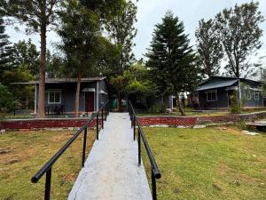 a walkway leading up to a house at Resort Rover - Sampala in Masinagudi