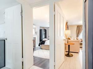 a room with a door open to a living room at Hexham Town Centre, Market Place View in Hexham