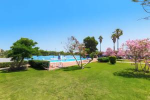 a park with a swimming pool and trees and grass at Casa Celeste a Torre dell'Orso in Torre dell'Orso +23 photos