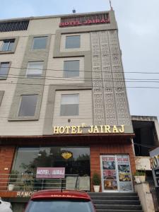 a building with a hotel jardinian sign on it at Hotel Jairaj in Alwar
