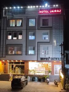 a hotel with a car parked in front of it at Hotel Jairaj in Alwar
