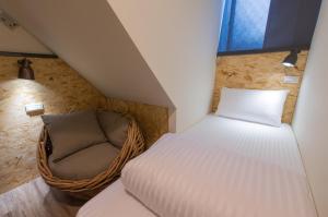 Postel nebo postele na pokoji v ubytování Beimen WOW Poshtel