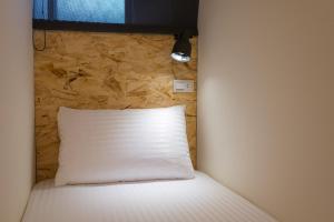 Postel nebo postele na pokoji v ubytování Beimen WOW Poshtel