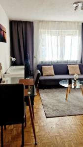 a living room with a couch and a table at Cozy and beautiful flat in the centrum in Essen