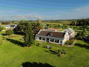 an aerial view of a large house with a yard at Springfontein Wine Estate in Stanford