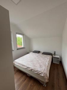a bedroom with a bed and a window at Vikendica Casa Verde in Konjic +38 photos