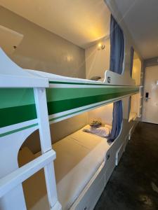 a bunk bed room with two bunk beds at Charlie's Hangar Surf Hostel in San Juan