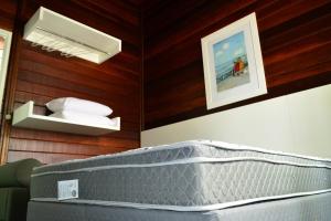 Ein Bett oder Betten in einem Zimmer der Unterkunft Casa De Madeira