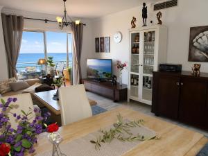 a living room with a view of the ocean at Appartement Tesoro del Mar in Torrox Costa