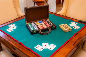 an open suitcase filled with playing cards and poker chips at Villa Privada De Lujo Con Spa in Inca