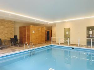a large swimming pool in a hotel room at Hotel Silvana in Böhl +21 photos