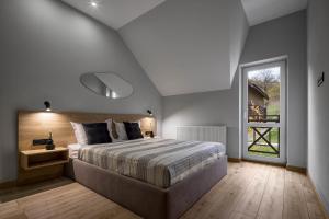 a bedroom with a large bed and a window at Apartel Villa Shayan in Shaian +56 photos