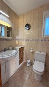 a bathroom with a toilet and a sink at Peniscola Bella in Peniscola