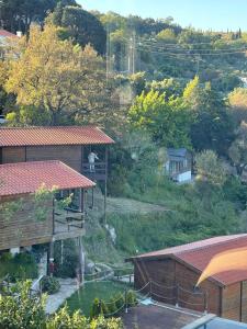 a group of buildings with trees and a hill at Quinta Altamira in Portalegre