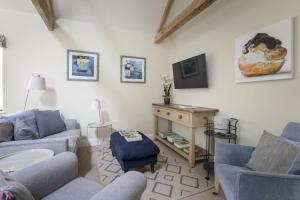 a living room with two couches and a table at The Hat Shop in Hexham