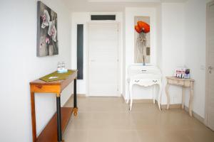a room with a desk and a table and a chair at Belvedere di Ciro' in Cirò
