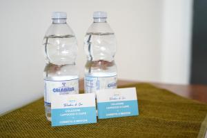 two bottles of water sitting on top of a table at Belvedere di Ciro' in Cirò