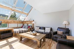 a living room with a couch and a table at 770 Potato Patch townhouse in Vail