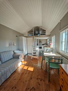 a living room with a couch and a table at Haus Alva in Ronneby
