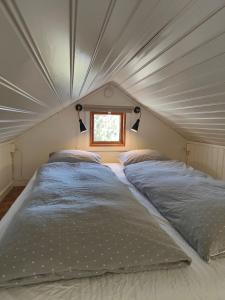 a couple of beds in a small room at Haus Alva in Ronneby