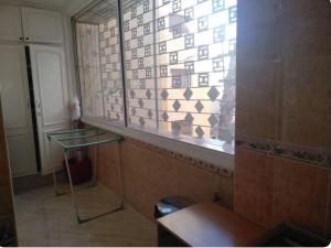 a window in a room with a tile wall at Apartment Centre Hamria in Meknès +7 photos