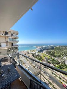 a balcony with a view of the beach and the ocean at Sheraton Royal Sea View in Alexandria