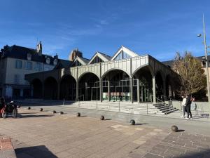 a large building with people standing in front of it at La Loge 45 in Rodez +15 photos