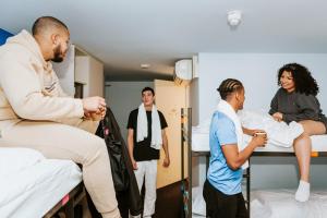 a group of people standing in a hospital room at Rotterdam Teleport Hostel in Rotterdam