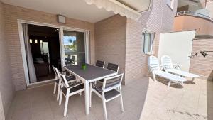 a table and chairs sitting on a patio at Residencial Ronda Mar in Denia