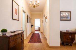 a hallway of a home with a chandelier at Residenza Maria Luisa in Padova