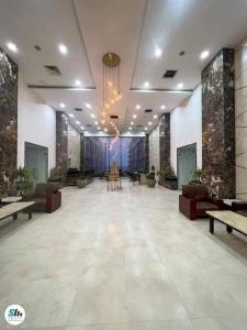 a lobby with a large room with couches and tables at Scandic resort chalet in Hurghada +34 photos