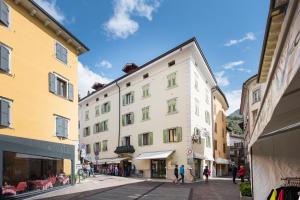 a street in a city with buildings at Appartamenti Vasco Renna Surf Center in Nago-Torbole