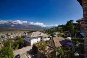 a view of a city with mountains in the background at Argyropolis Boutique Hotel in Gjirokastër