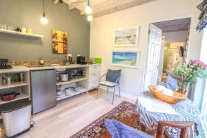 a kitchen with a sink and a counter at Airconditioned Apartment for 3 guests. in Hermanus