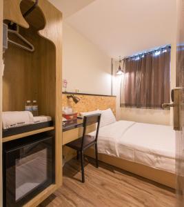 Postel nebo postele na pokoji v ubytování Beimen WOW Poshtel