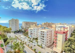 an aerial view of a city with tall buildings at Parque Marbella Three Bedroom Apartment in Marbella