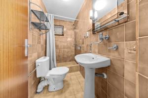 a bathroom with a toilet and a sink at Chata Danube in Gabčíkovo