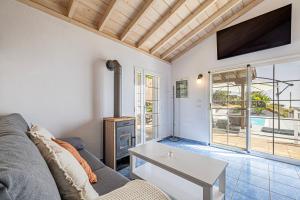 a living room with a couch and a table at Casa Yuliana in Tijarafe