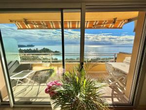 a balcony with a view of the ocean at MONACO - FANTASTIC Apartment and Sea View -1 bedroom 80m2 in Roquebrune-Cap-Martin