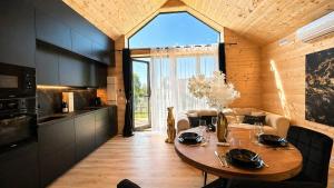 a kitchen with a wooden table in a room at Cottage de luxe en bois in Longnes