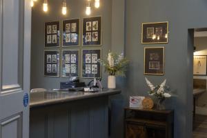 a salon with a counter and pictures on the wall at The Riverside, WorldHotels Distinctive in Salisbury
