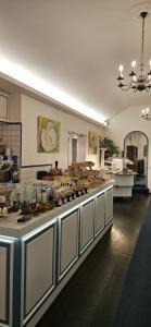 a kitchen with a large counter in a kitchen at Strandhotel Sylt Wenningstedt in Wenningstedt