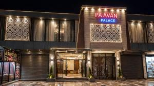 a building with a pajani palace sign on it at Paavan Palace in Ayodhya