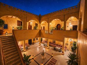 an overhead view of a building with chairs and tables at Camels House in Merzouga