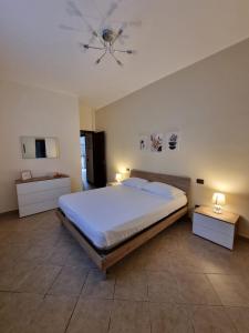 a bedroom with a large bed and a ceiling fan at Villa Sunshine in Balestrate +26 photos